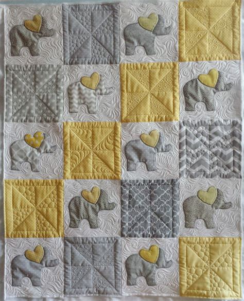 Just finished quilting a client's baby elephant quilt. She used heart ...