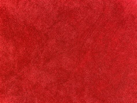 Dark red velvet fabric texture used as background. Empty dark red ...