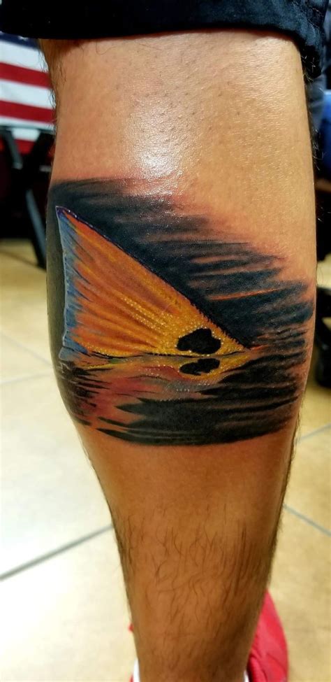 My boyfriend's red fish fin tattoo on his calf | Tattoos, Tattoo sleeve ...