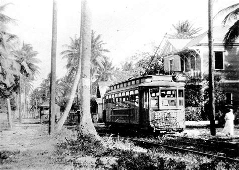 an old black and white photo of a trolley on the tracks in front of ...