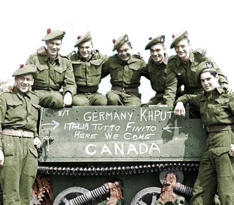 Canadian soldiers pose by their Bren carrier, shortly after 8am when ...