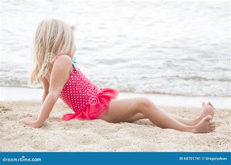 Little Girl Sunbathing on the Beach Stock Image - Image of arms, smile ...