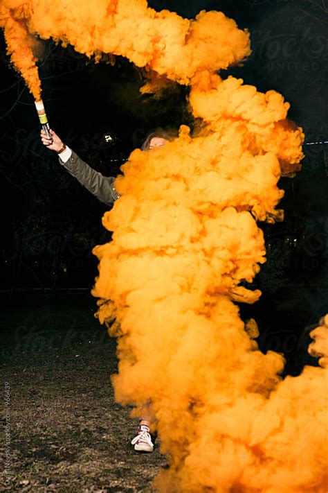 Woman holding orange smoke bomb by T-REX & Flower - Smoke bomb, Concept ...