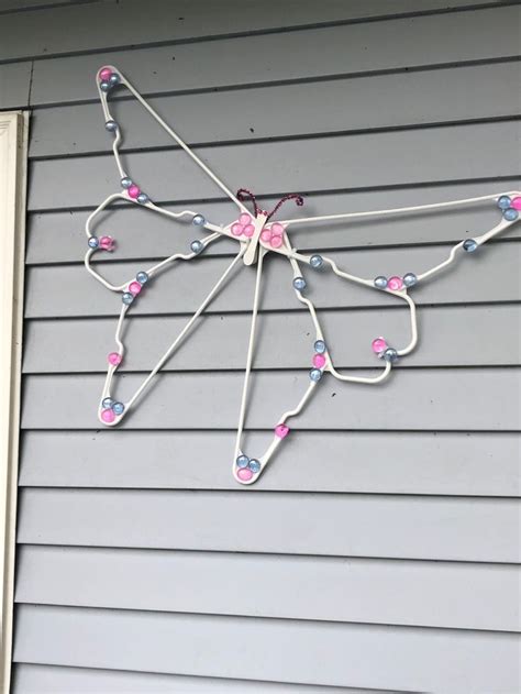 Plastic hanger butterfly | Hanger crafts, Wire hanger crafts, Dollar ...