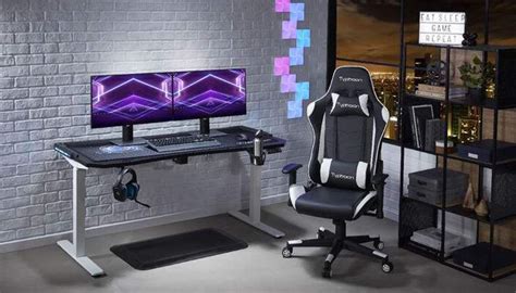 a gaming chair sitting in front of a desk with a computer monitor and ...