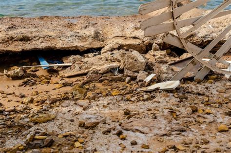 Premium Photo | Rubbish on polluted beach Environmental or pollution ...