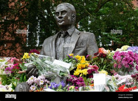 Alan Turing statue surrounded by flowers on his birthday. Sackville ...