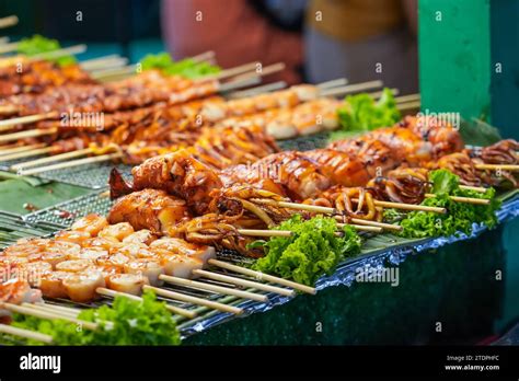 Seafood octopus and other meat balls on a street food stall Stock Photo ...