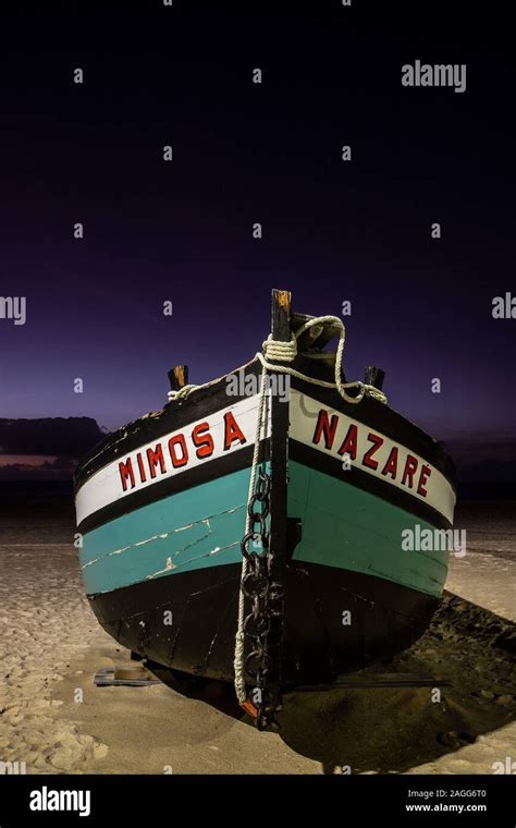 fishing boats at the beach at night Stock Photo - Alamy