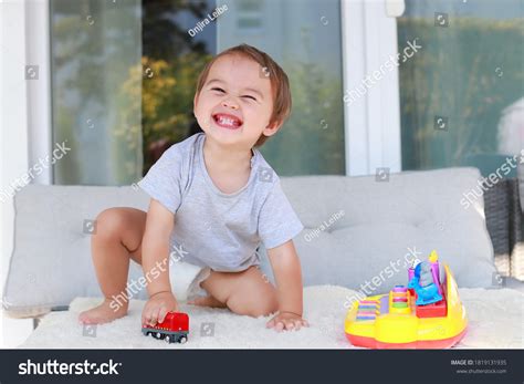 Baby Boy Laughing While Playing Toy Stock Photo 1819131935 | Shutterstock