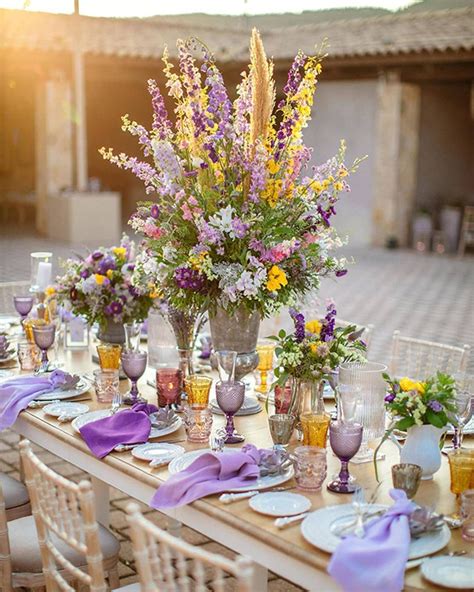 Beautiful outdoor wedding decoration with purple and yellow details ...