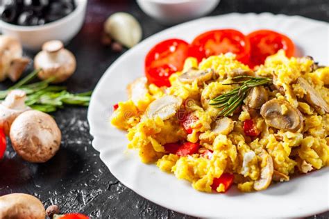 Scrambled Eggs With Mushrooms And Vegetables In White Plate Stock Image ...