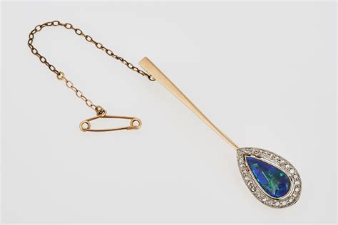 Diamond and Opal Brooch - Shapiro Auctioneers