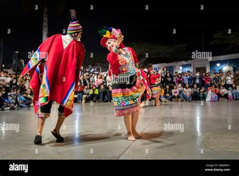 Dancers in colourful costumes performing traditional Huayno Cusqueño ...