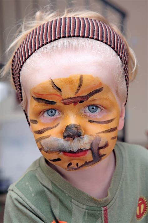 Young Boy or Toddler Covered in Tiger Face Paint Stock Photo - Image of ...