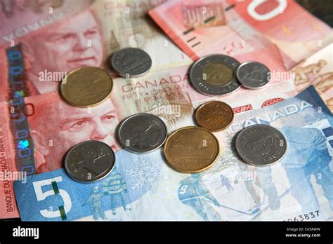 canadian currency including coins and notes Stock Photo - Alamy