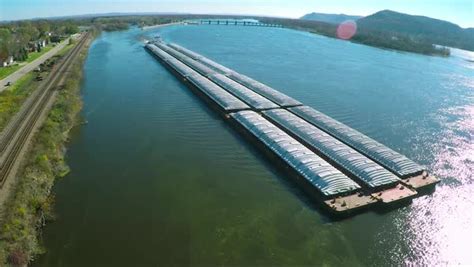 A very good aerial of a large coal barge going up the Mississippi River ...