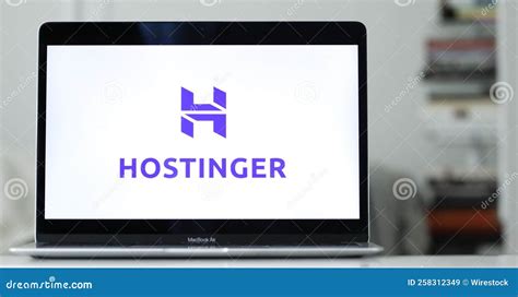 Logo Design of Hostinger on a Laptop Screen in Blurred Background ...