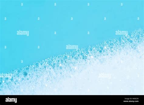 Backgrounds of blue wet soap bubbles on blue background. Laundry ...