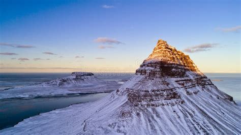 Kirkjufell Mountain with Frozen Water Falls in Winter, Iceland. Stock ...