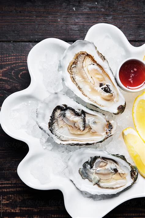 "Plate Of Three Big Oysters, Ready To Be Consumed" by Stocksy ...