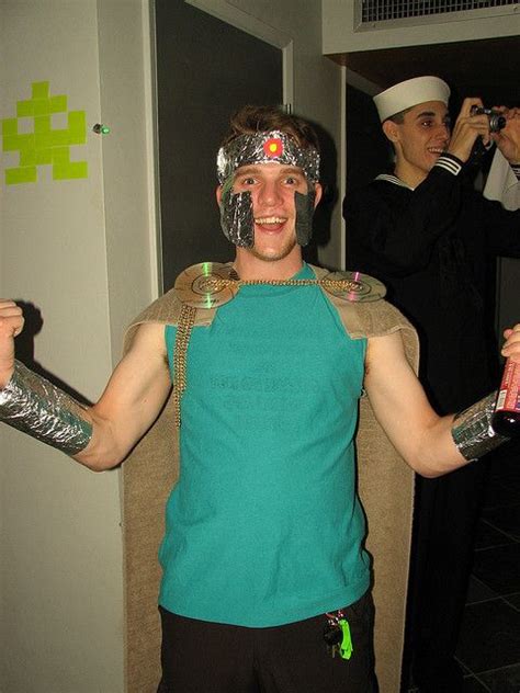 a man in a costume is holding two cans