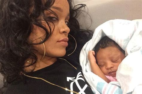 Broody Rihanna cradles her cousin's new born baby | London Evening Standard