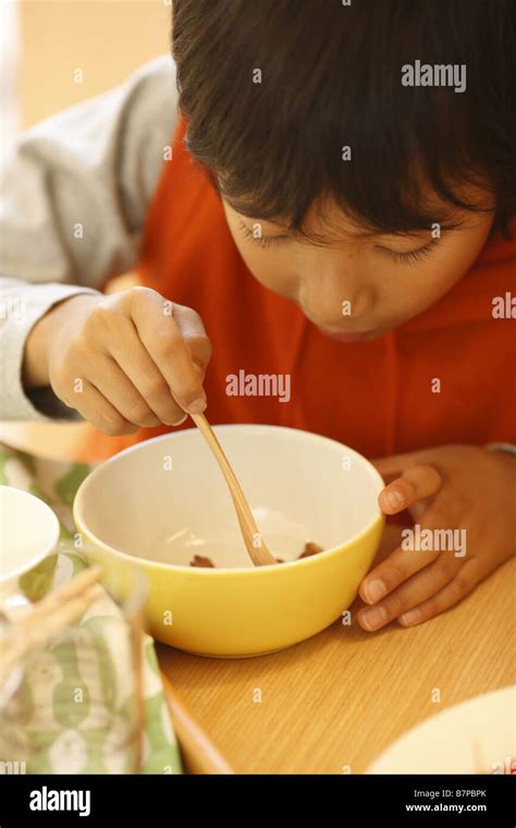 A boy having breakfast Stock Photo - Alamy