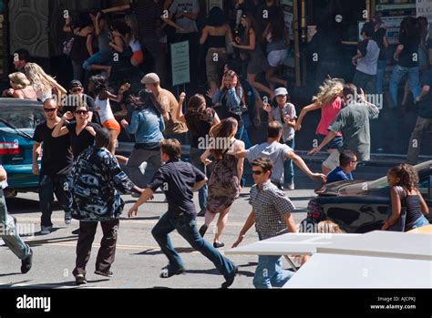 Crowd running in street Stock Photo - Alamy