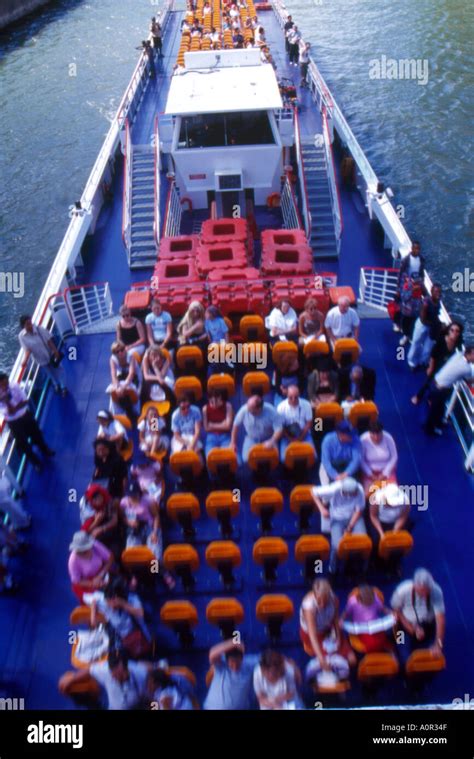 tourists in a boat seine river paris france Stock Photo - Alamy