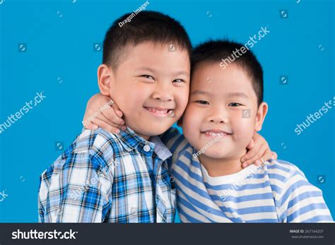 Cheerful Chinese Brothers Hugging Looking Camera Stock Photo 267164207 ...