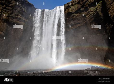 Waterfall with a rainbow, Skogafoss, Iceland Stock Photo - Alamy