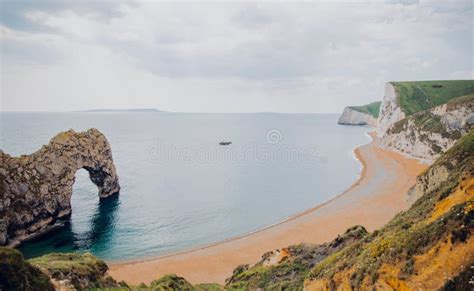 Aerial View of Peaceful Durdle Beach and Durdle Door in Dorset, England ...