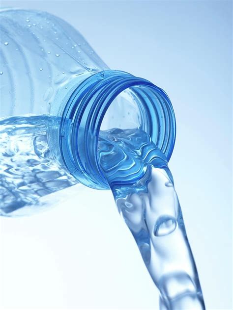 Pouring Water From Bottle Photograph by Science Photo Library | Pixels