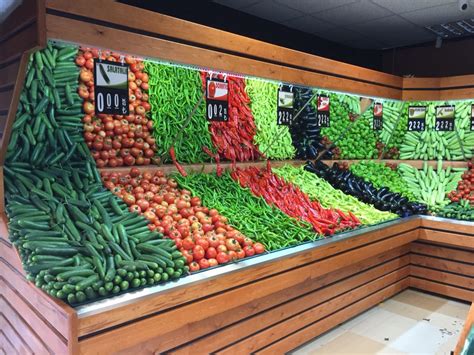 a display in a grocery store filled with lots of vegetables