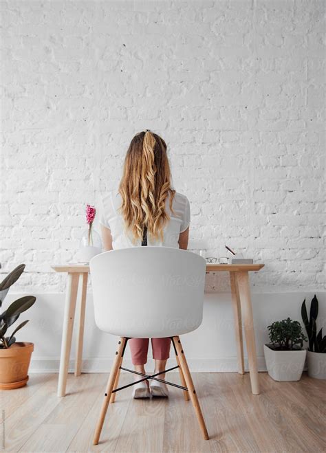 "Woman Sitting At Her Home Office" by Stocksy Contributor "Lumina ...