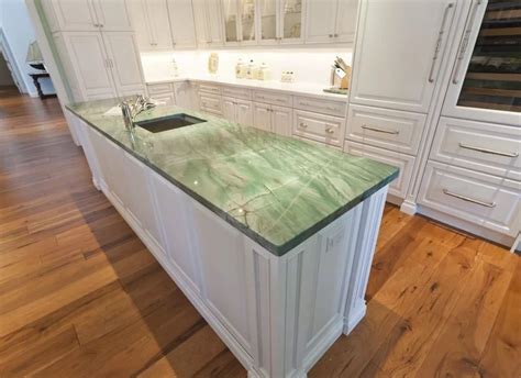 Green marbled quartzite for a beautiful traditional kitchen in Miami! # ...