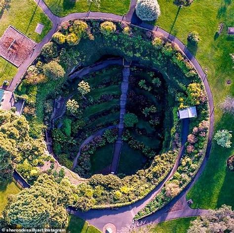 Travellers visit Umpherston sinkhole in Mount Gambier to capture ...