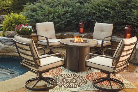 Predmore Beige and Brown Round Fire Pit Outdoor Dining Set from Ashley ...