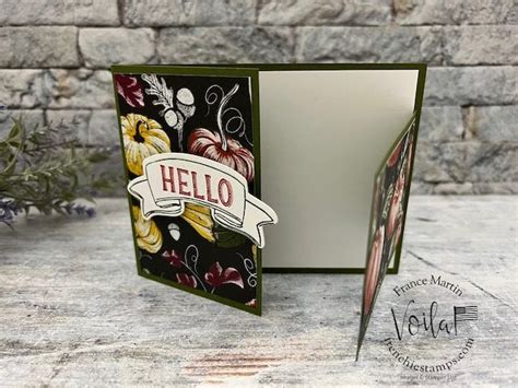 an open card with the word hello on it and some flowers in front of it