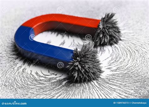 Red and Blue Horseshoe Magnet with Iron Filings Stock Image - Image of ...