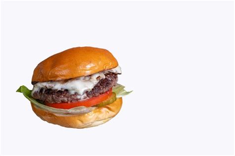 Premium Photo | Cheeseburger on white background