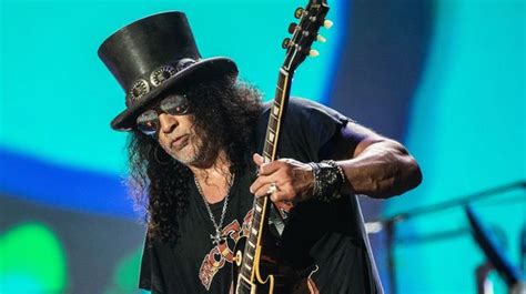 Guns N' Roses guitarist Slash always wears a top hat on stage for very ...