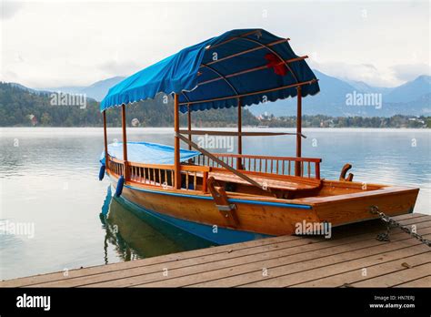 Lake Bled and traditional wooden Pletna at autumn in Slovenia Stock ...