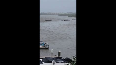 Debris flows through flooded area of Naples as Hurricane Ian moves over ...