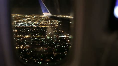 Airplane Window Seat - View Of Los Angeles At Night And Wing Of Plane ...