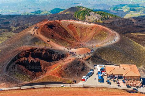 Stunning view at the volcanic crater and groups of tourists walking ...