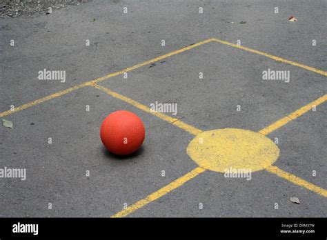 four square game ball yellow concrete hardtop asphalt outdoor Stock ...