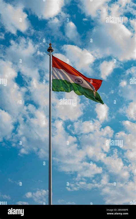 Indian national flag hoisted in the blue cloudy sky on 74th Indian ...