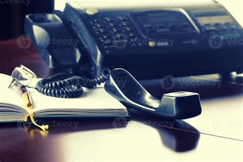 pick up the phone on the desktop 908302 Stock Photo at Vecteezy